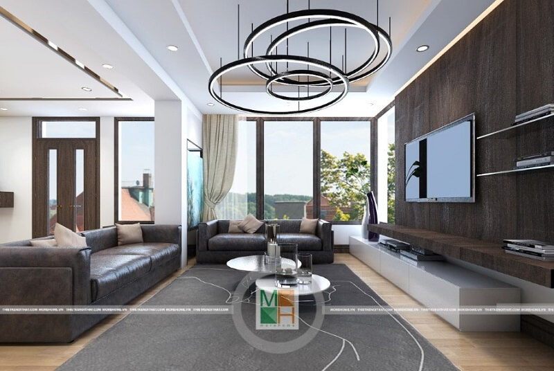 Trang trí nội thất phòng khách chung cư với đồ nội thất sử dụng tông màu veneer trầm mang đến sự trang trọng và hiện đại cho không gian nội thất.